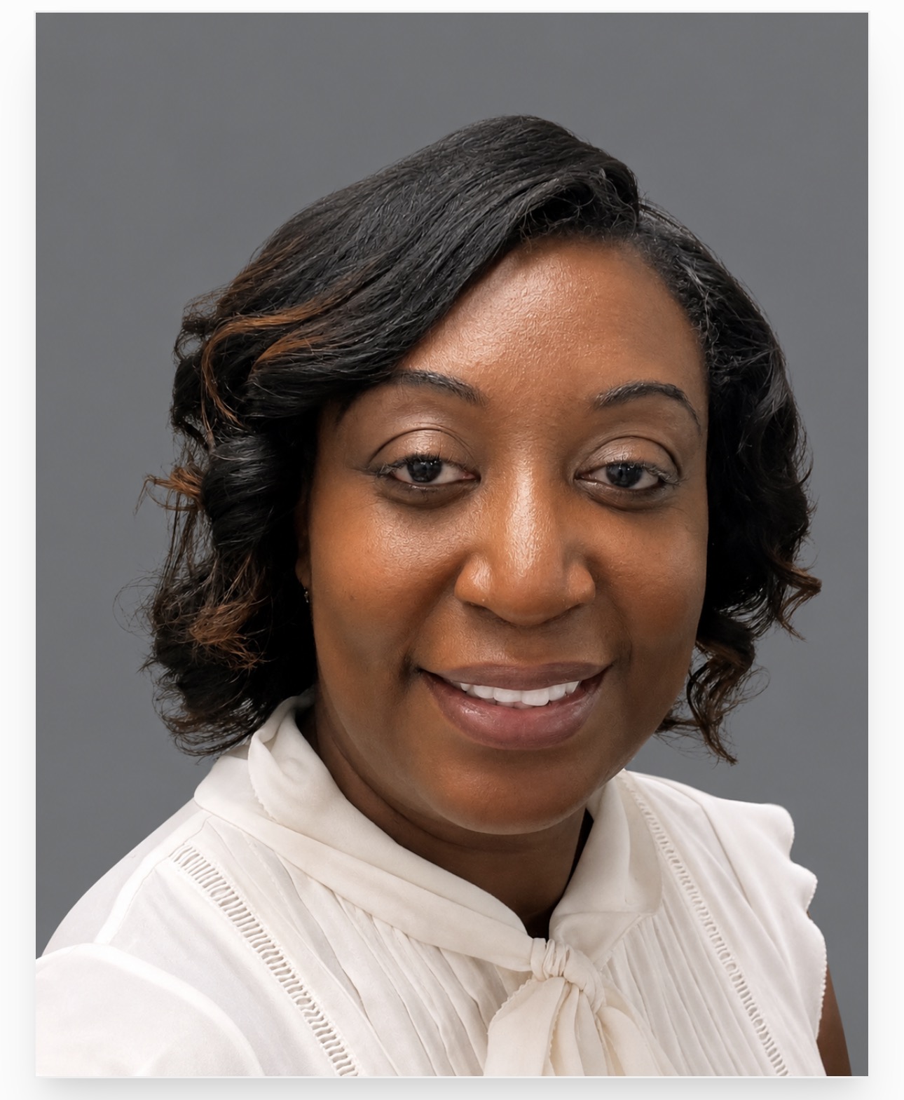 Portrait of Dr. Tamara Moore in a white blouse